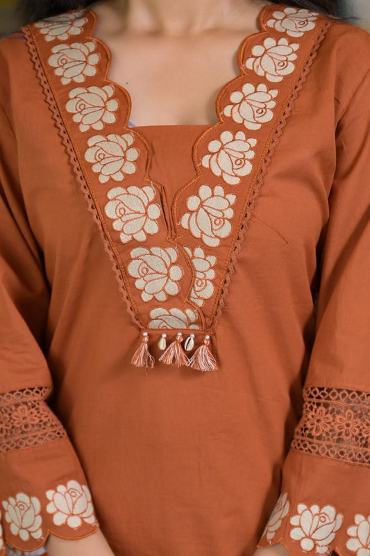 Luxe Suit Set Features Delicate Cutwork on the sleeves,kurta Hem and Pant Cuffs with beautiful Mul-Mul Dupatta.