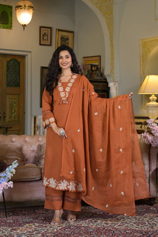 Luxe Suit Set Features Delicate Cutwork on the sleeves,kurta Hem and Pant Cuffs with beautiful Mul-Mul Dupatta.