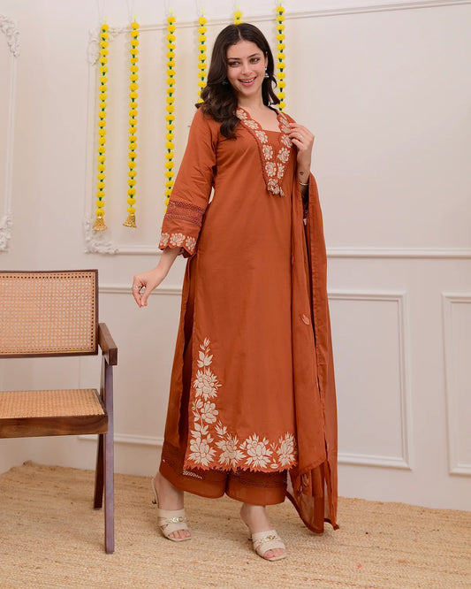 Luxe Suit Set Features Delicate Cutwork on the sleeves,kurta Hem and Pant Cuffs with beautiful Mul-Mul Dupatta.
