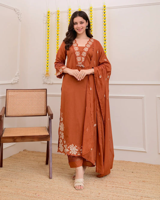 Luxe Suit Set Features Delicate Cutwork on the sleeves,kurta Hem and Pant Cuffs with beautiful Mul-Mul Dupatta.